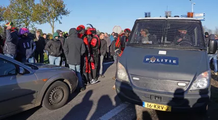 Police at the A28 offramp to Staphorst where people in blackface surrounded Kick Out Zwarte Piet cars to harass the protesters and stop them reaching their demonstration at the Sinterklaas arrival party, 19 November 2022