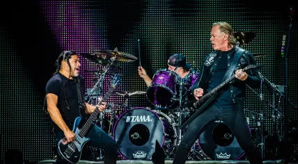 Metallica's Robert Trujillo, Lars Ulrich, and James Hetfield perform during their show at the Johan Cruijff Arena on 11 June 2019