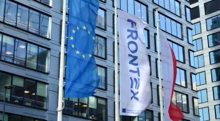EU and Frontex flags at the Frontex building in Warsaw, Poland