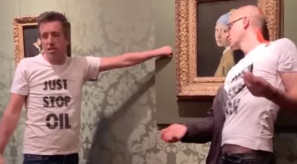 Activists glued themselves to The Girl with a Pearl Earring and the wall surrounding it at the Mauritshuis in The Hague. 27 Oct. 2022