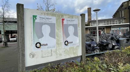 Posters showing fictitious names of construction workers who died in the construction of World Cup infrastructure in Qatar. Amsterdam Oost, 9 November 2022