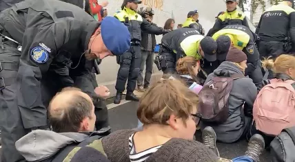 Police and Marechaussee break up an Extinction Rebellion protest on the A12 in The Hague. 26 November 2022