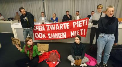 Extinction Rebellion activists protest against blackface Zwarte Piet at a city council meeting in Emmen, 7 November 2022