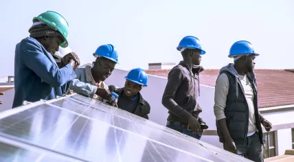 Young Africa students involved in a solar panel project