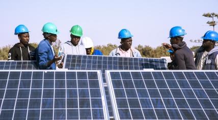 Young Africa students involved in a solar panel project