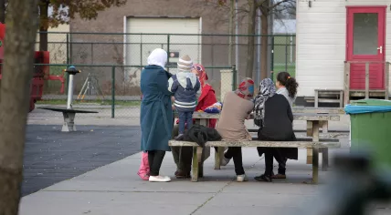 A small group of people gathered at the Ter Apel asylum seeker reception center in November 2014