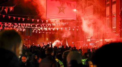 Fans of Morocco's national football team celebrate their victory over Canada in the 2022 World Cup. 1 December 2022