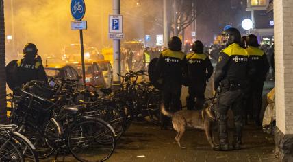 Riot police intervene on Mecatorplein in Amsterdam after celebrations for Morocco's win against Spain in the Qatar World Cup turned into riots, 6 December 2022