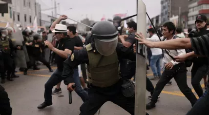 Clashes between protestors and police in Lima after Peru’s president, Pedro Castillo, was arrested following an attempt to dissolve Congress. 8 December 2022