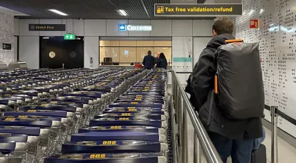 People waiting for VAT refunds at the Global Blue checkpoint from Douane, the Dutch Customs office, in Schiphol Airport. 13 December 2022