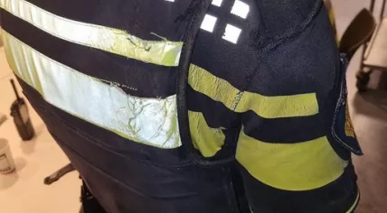 Torn uniform of the police officer who was dragged by the car more than 300 meters while holding on to the suspect.