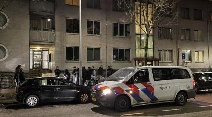 Plainclothes police in Amsterdam address a group of people on the street just before midnight on New Year’s Eve. 31 December 2022