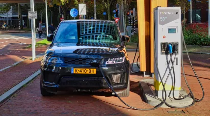 An electric car at a charging station in The Hague