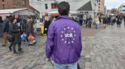 Person campaigning in the streets of Rotterdam for the Volt Europa political party, during the Dutch municipal elections of 2022