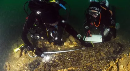 Nautical Archaeology Society (NAS) divers measuring timbers of the Klein Hollandia
