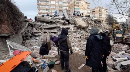 People search the wreckage of a collapsed building, Diyarbakır, Turkey, after multiple earthquakes. 6 February 2023