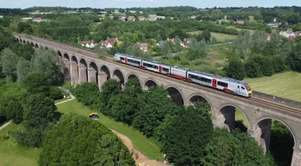 An Abellio Greater Anglia train crosses Chappel Viaduct in Chappel & Wakes Colne in Essex, UK. 26 June 2021