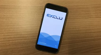 Rendering of the Exclu Messenger app loading on an iPhone 12 Mini. February 2023