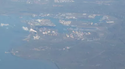 An areial view of Vlissingen-Oost, including Hoechst Holland (top, center), the Borssele nuclear plant (center-left), the town of Borssele (bottom-center), the Zeeland Refinery area (center-right), and the Vopak gas terminal (right). 19 March 2011