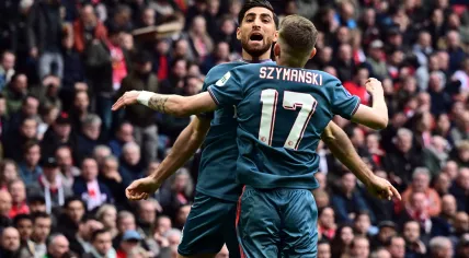 Alireza Jahanbaksh of Feyenoord, Sebastian Szymanski of Feyenoord celebrate the 2-2 during the Dutch eredivisie match between Ajax Amsterdam and Feyenoord in the Johan Cruijff ArenA on 19 march 2023 in Amsterdam, Netherlands.