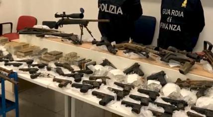 A large collection of weapons, body armor, and fake uniforms found during an investigation in Giugliano, Campania, Italy. 2 March 2023