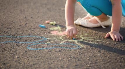 Child playing with chalk