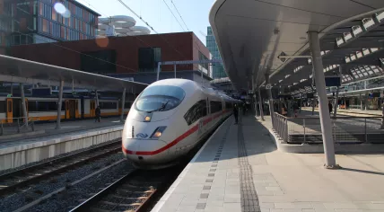 A Deutsche Bahn and NS InterCity Express (ICE) from Berlin to Amsterdam stopped at a platform at Utrecht Centraal in 2019