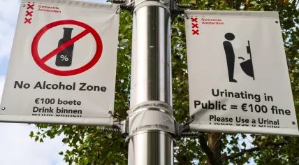 Amsterdam city signs about bans on public alcohol consumption and public urination. September 2022