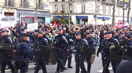 French national police preparing for crowd control and riot measures during a large protest against pension reforms in Paris. 23 March 2023