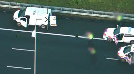 Police on the A27 surrounding a van with which a 15-year-old boy was abducted from Amsterdam, 10 January 2023