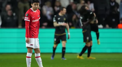 Yukinari Sugawara of AZ Alkmaar disappointed after the 2-0 during the UEFA Conference League quarter final match between RSC Anderlecht and AZ Alkmaar in the Lotto Park stadium on 13 April 2023 in Brussels, Belgium
