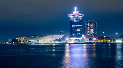 The Eye Filmmuseum and Adam Toren lit up at night in January 2021