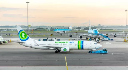 Transavia airlines boeing 737-700 taxiing at Schiphol Airport at sunrise