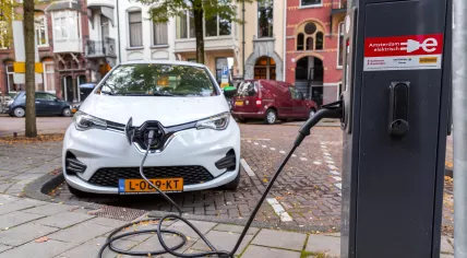 An electric car charging in Amsterdam