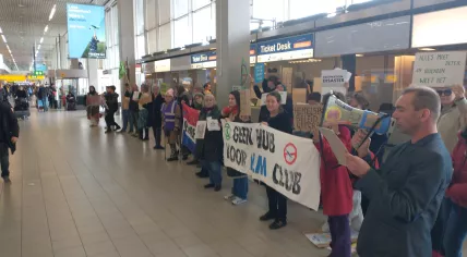 Extinction Rebellion activists protesting at the KLM counters in Schiphol Airport's departure hall, 10 April 2023