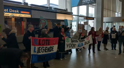 Extinction Rebellion activists protesting at the KLM counters in Schiphol Airport's departure hall, 10 April 2023