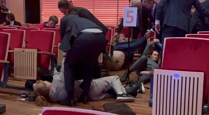 Security guards in the Muziekgebouw in Amsterdam remove protestors from the ING shareholders' meeting. 24 April 2023