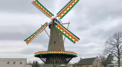 Artist rendering of the Rozenburg Windmill decorated for King's Day 2023 in Rotterdam