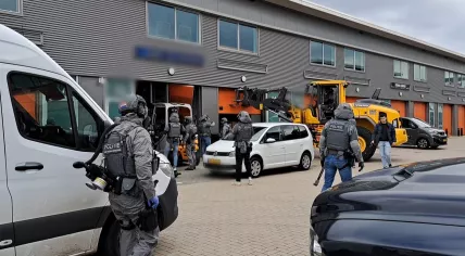 Police search a Ridderkerk storage space as part of an investigation into drug and weapons trafficking. 18 April 2023
