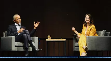 Barack Obama speaking with Janine Abbring at the Ziggo Dome in Amsterdam. 1 May 2023