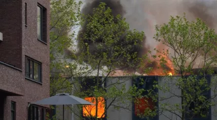 A fire rages in a vacant building on Lichtstraat in Eindhoven, Noord-Brabant. 13 May 2023