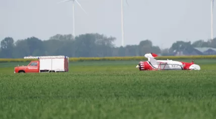 A Waco Classic YMF biplane flipped over after the pilot landed it next to the Oostwold Airport runway. 18 May 2023