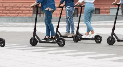 People on electric scooters.