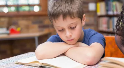 Child reading a book 