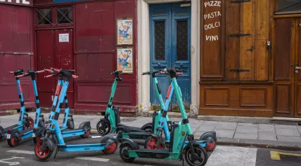 Electric scooters parked on the street in Paris, France
