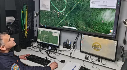 A rescue worker tracks the progress of the search for victims after a small plane crash involving Dutch victims at Mount Kapeli. 20 May 2023