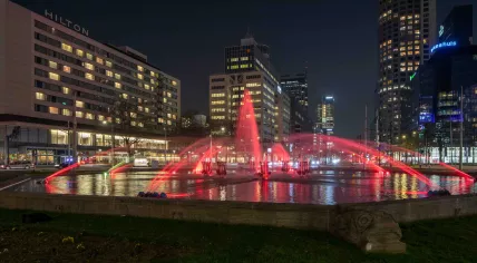 Rotterdam lights the Hofplein fountain in red and white to celebrate Feyenoord's 16th national championship, 14 May 2023