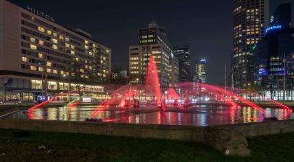 Rotterdam lights the Hofplein fountain in red and white to celebrate Feyenoord's 16th national championship, 14 May 2023