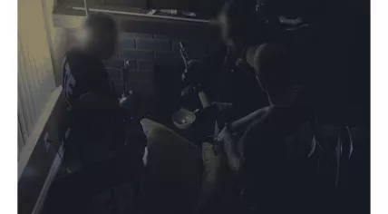 An image from an undated video featuring FBI and ATF agents raiding a location in the United States linked to Monopoly Market as part of Operation SpecTor