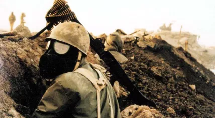 An Iranian soldier wearing a gas mask during the Iran-Iraq War, March 1985.
